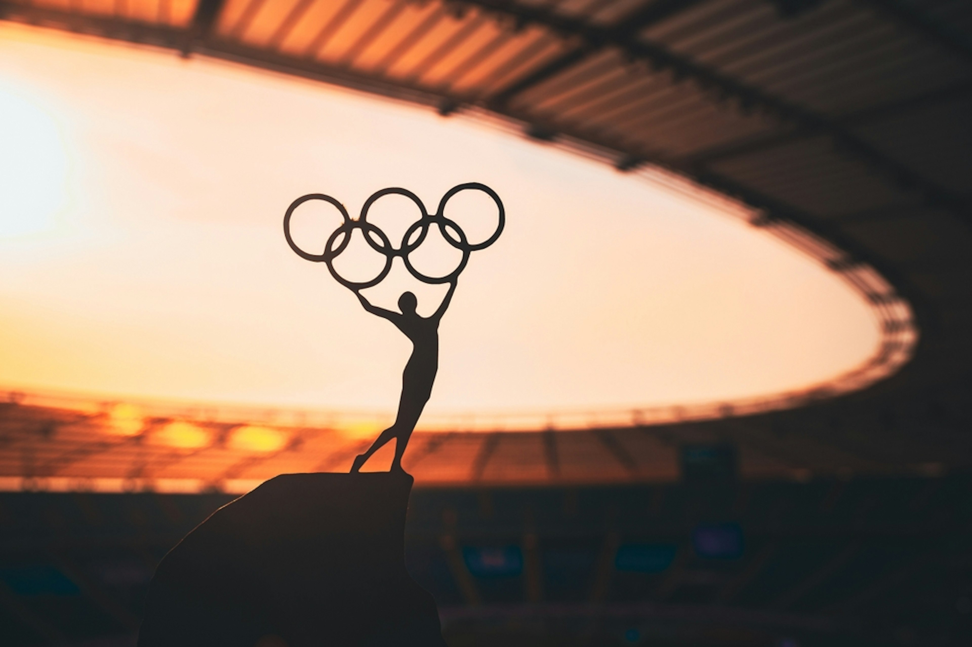 Figure holding Olympic rings