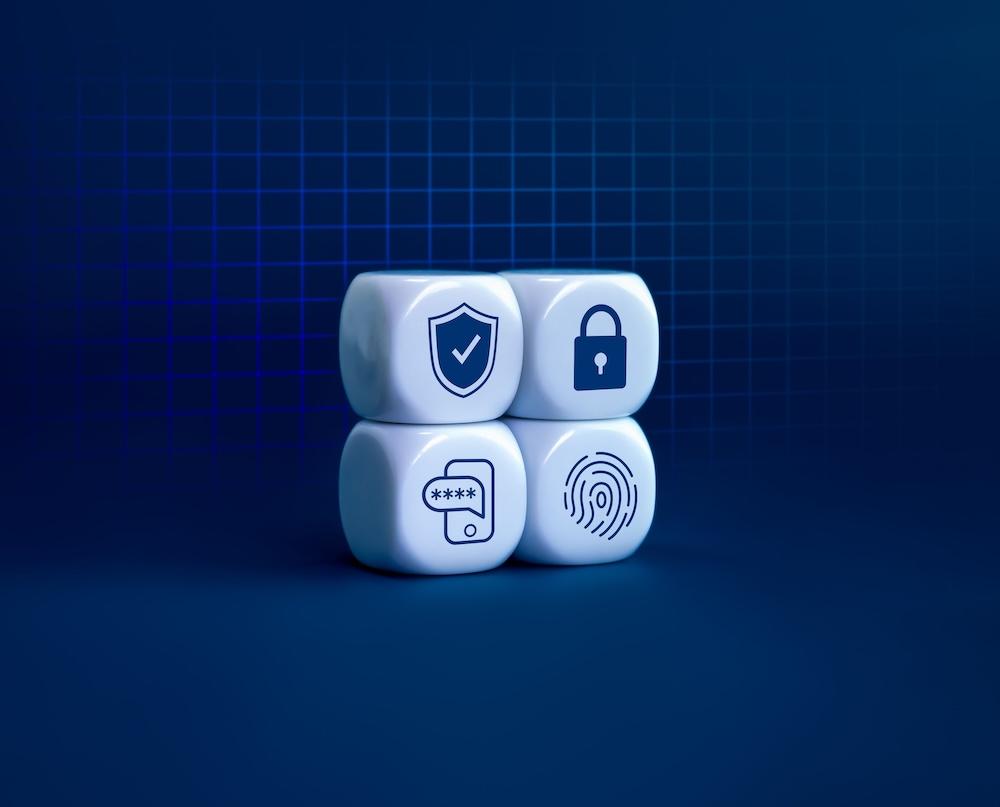 four white blocks with icons of a shield, a lock, a mobile device and a fingerprint